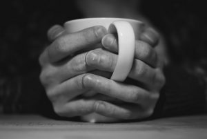 Two hands, one cup